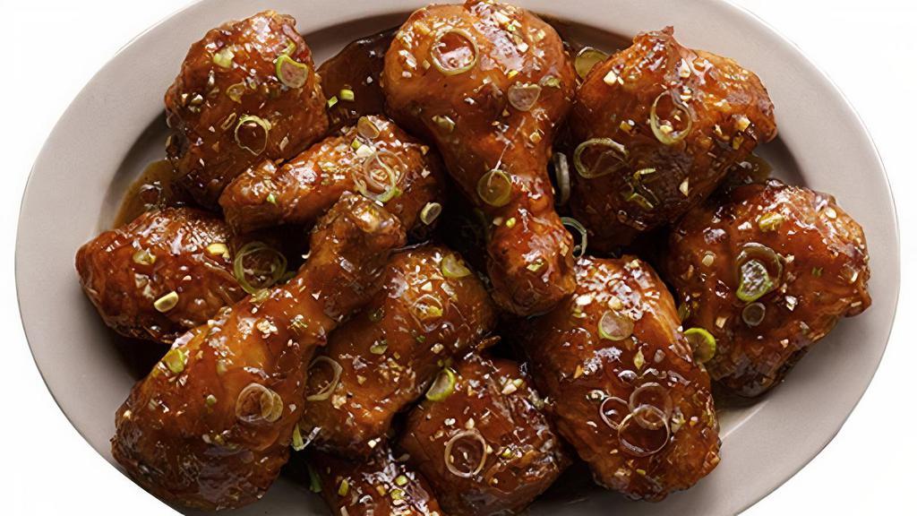 Galbi Wings · A lightly sweet and savory sauce that has a off the grill flavor. Mixed with green onions and garnished with sesame seeds.
