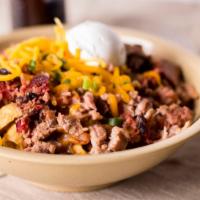 Frito Pie · Fritos, Chopped Brisket, BBQ Beans, Cheese, Chives and BBQ Sauce