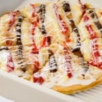 Dessert Pizza · Choice of fillings (apple, strawberry, vanilla, chocolate) spooned over with Bavarian cream,...