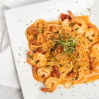 Shrimp Siciliano · Sautéed shallots, scallions, sun-dried tomatoes, garlic oil, basil, white wine lemon sauce a...