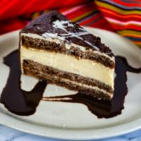 Chocolate Tres Leches Cheesecake · Cheesecake, chocolate and tres leches all together is one great taste! Topped with a drizzle...