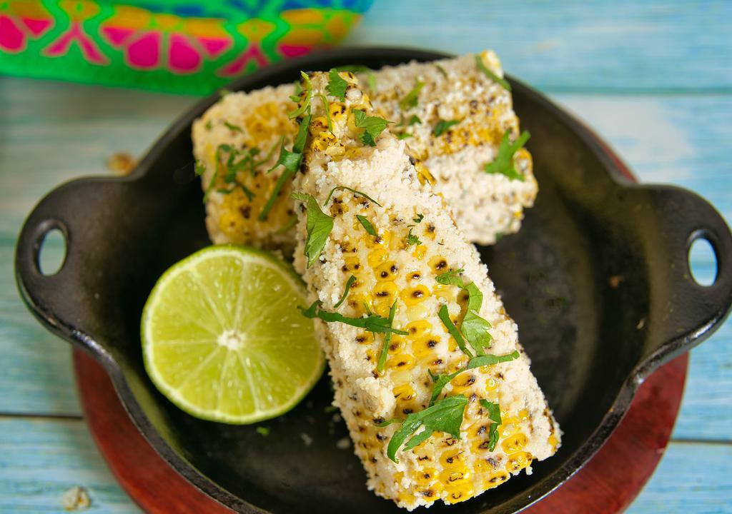 Mexican Corn  · Grilled (3 half cobs) and topped with garlic mayonnaise, cotija cheese, seasoning and cilantro.