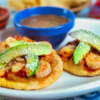 Shrimp Sopes · Two handmade corn masa tortillas topped with refried beans, grilled marinated shrimp, adobo ...