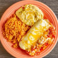 Fajita Enchiladas · Two flour tortillas filled with your choice of fajita beef or chicken, topped with Chile con...