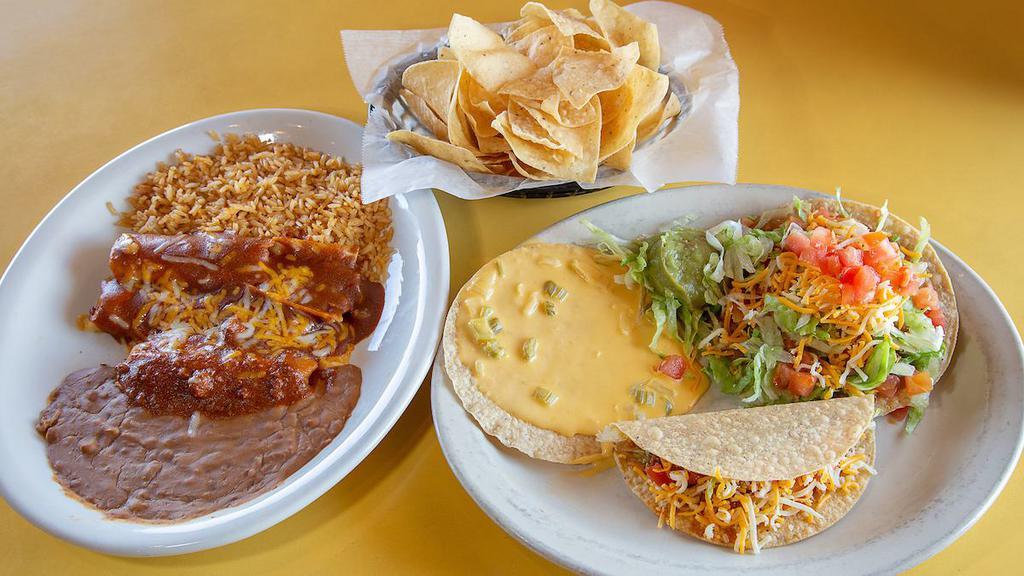 Monterey Dinner · Two cheese enchiladas with gravy, a bean chalupa, beef taco, tamale with chili, Chile con queso tostada and guacamole.