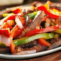 Traditional Fajitas · Your choice of beef or chicken fajitas grilled to perfection, served with homemade guacamole...