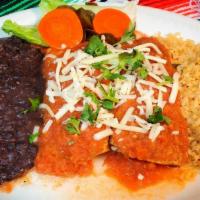 Shrimp Enchiladas · Two hand rolled corn tortillas stuffed with spicy shrimp topped with our famous homemade Ran...