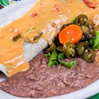 Burrito Grande · An OUTRAGEOUSLY huge burrito filled with your choice of meat, refried beans, lettuce, tomato...