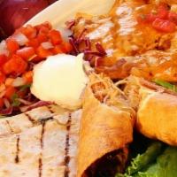Ed Couch Sampler · The perfect appetizer for you and friends. Bean and cheese nachos, chicken flautitas chicken...