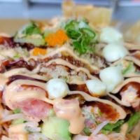 Spicy Tuna Tower · Sushi rice, crab salad, avocado, spicy tuna, spicy mayo, green onions, masago, drizzle with ...