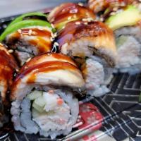 Dragon Roll · Shredded crab mix, cucumber, topped with avocado, eel sauce, and sesame seeds.