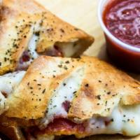Pepperoni Stromboli · Eight pieces of stromboli packed with cheese and pepperoni, sprinkled with Italian seasoning...