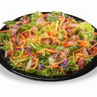 Grilled Chicken Salad · A generous portion of grilled chicken breast served on a crisp blend of romaine and iceberg ...