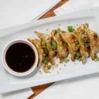 Gyoza (6 Pieces) · Pan-fried pork dumpling, served with ginger soy sauce.