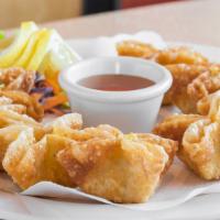 Crab Rangoon (8 Pieces) · Fried wonton stuffed with crabmeat, onions, cream cheese, and carrots.