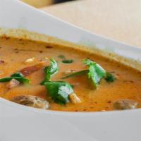 Tom Kha Soup Bowl · Traditional Thai coconut lemongrass soup with chili paste, coconut milk, galangal, lime, oni...