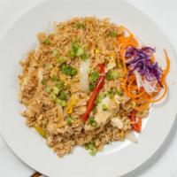 King Fried Rice · Signature wok-tossed rice with egg, Thai chili paste, onions, green onions, and bell peppers.