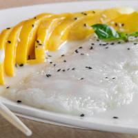 Mango Sticky Rice · Mango with sweet sticky rice and coconut milk drizzled on top.