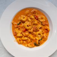 Tortellini Al Panna · Cheese tortellini sautéed with fresh chopped tomatoes, garlic, butter, served in sherry wine...