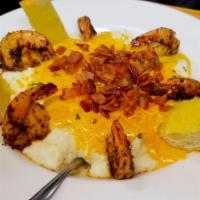 Shrimp & Grits · Blackened shrimp and creamy southern grits smothered with our lobster bisque, bacon crumbles...