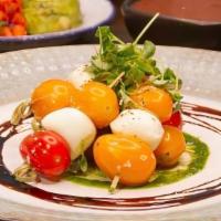 Caprese Skewers · Buffalo Mozzarella, Cherry Tomato,
Balsamic Reduction, Basil Pesto
