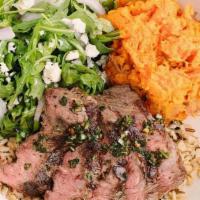 Grass Fed Steak · 100% grass fed steak, herb marinated over a bed of warm organic rice & quinoa, with chimichu...