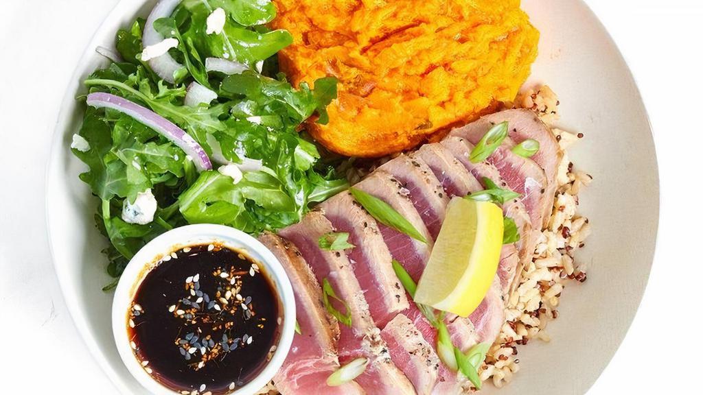 Line-Caught Tuna · line-caught Ahi tuna, grilled medium-rare, with sesame ginger sauce & scallions on a bed of organic rice & red quinoa