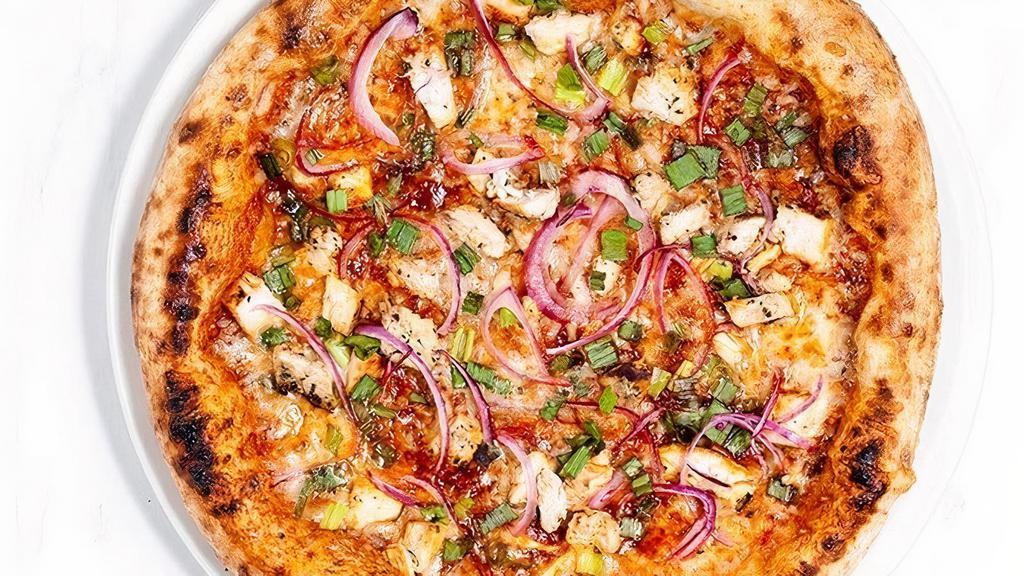 Bbq Pizza · BBQ sauce, herb marinated chicken, red & green onion, cilantro, smoky pepper jack