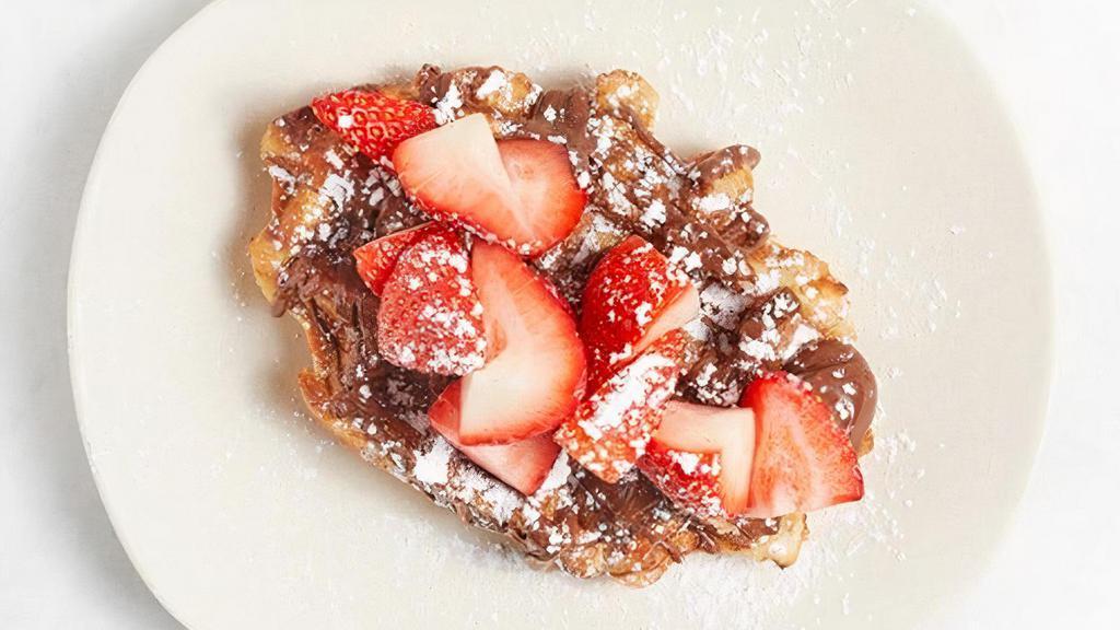 Strawberry Nutella Waffle · Belgian Pearl Sugar waffle, fresh strawberries, Nutella, powdered sugar
