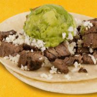 Taco Matamoros · This taco is made up of two soft lightly fried corn tortillas topped with tender sirloin, av...