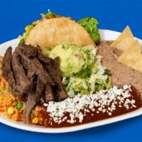Plate Tampiquena · Take a tour of México with a single bite of this plate. Enjoy a savory crispy picadillo taco...