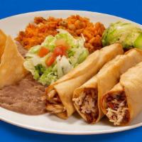 Plate Flautas Ck Guisada · These three deep-fried rolled corn tortillas come ﬁlled with chicken guisada, garnished with...
