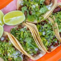 Street Tacos (5 Corn Tortilla) · corn tortilla tacos topped with onions and cilantro