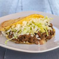 Gordita · Gordita filled with beans, cheese, sour cream, lettuce & your choice of meat.