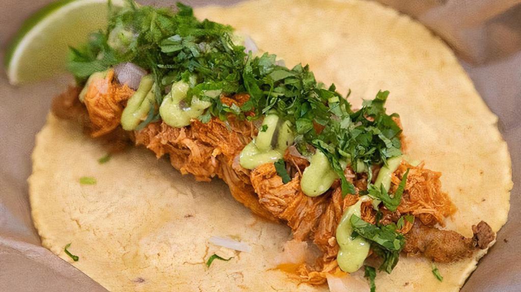 Chili Wagon · New Mexico Red Chili Stewed Chicken With A Fried Poblano Pepper Strip, Onions, Avocado Sauce, Fresh Cilantro and a Lime Wedge on a Corn Tortilla. Contains: Soy, Egg, Dairy
