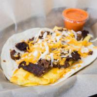 Ranch Hand · Tender strips of grilled beef fajita with scrambled eggs & shredded cheese.  Served with DIA...