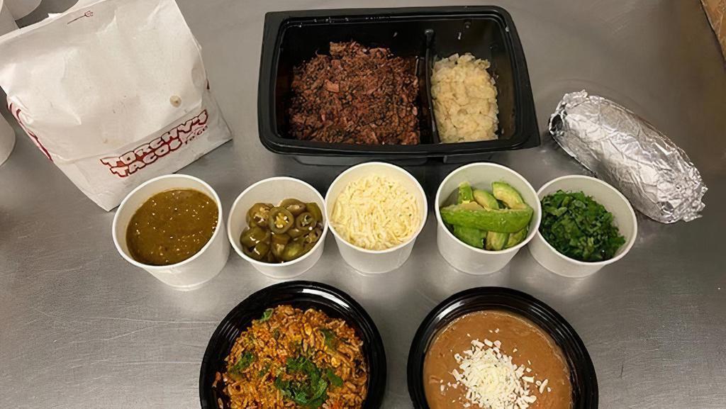 Family Pack Crossroads · Family packs serve 4-5 people! Smoked Beef Brisket, Grilled Onions. & Pickled JalapeÃ±os, Jack Cheese, Avocado Slices, Cilantro, Tomatillo Sauce. Includes Homemade Chips, Beans, Rice & your choice of Tortillas (Flour, Corn, Combo). Dairy, Soy, Avocado.