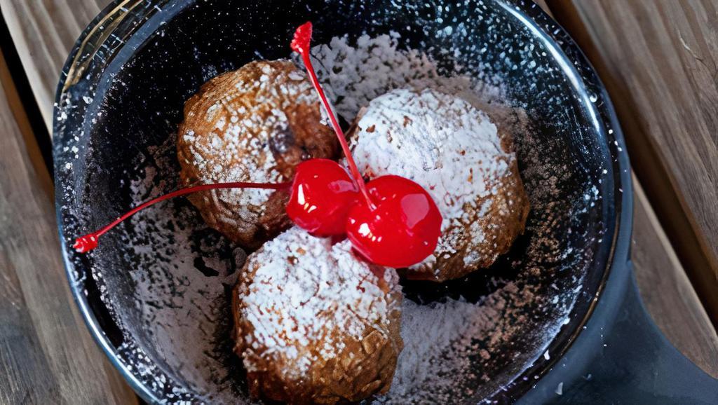 Lil' Nookies - 3Ct · Fried chocolate chip cookie dough dusted with powdered sugar & topped with cherries. Dairy, Soy, Gluten, Eggs