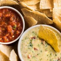 Homemade Queso & Salsa · Creamy, homemade green chile queso, served with warm, crunchy tortilla chips and our own fre...