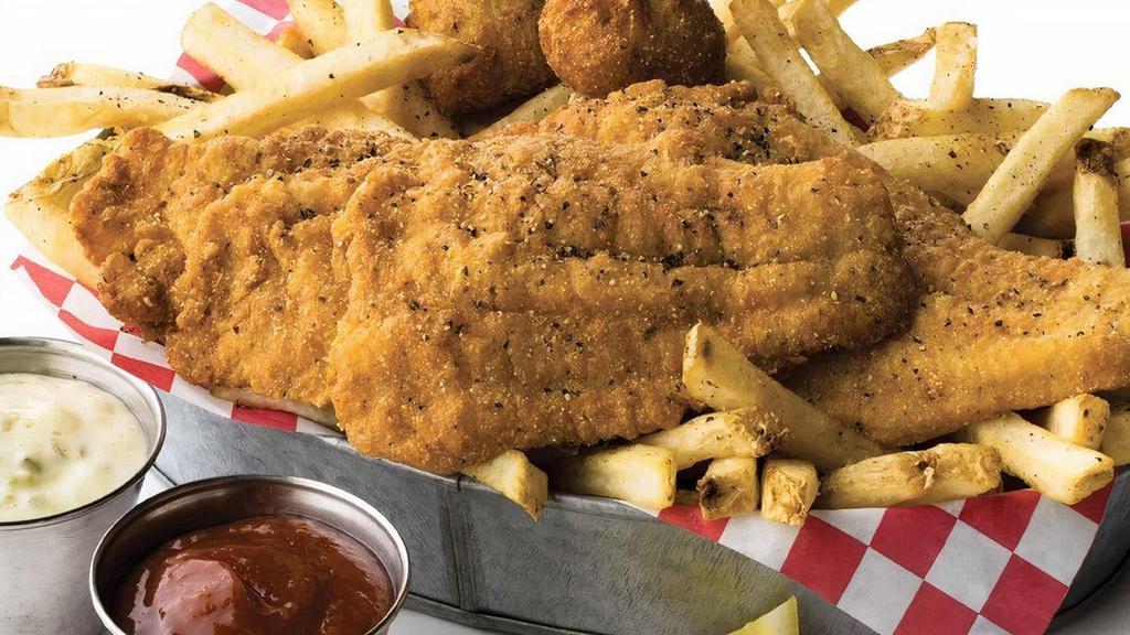 Fried Catfish · Lightly breaded, crispy fried catfish fillets, served over french fries and jalapeño hushpuppies  .