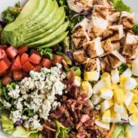 Cobb Salad · Sliced avocado, bacon, bleu cheese crumbles, tomatoes, chopped egg, and fresh mixed greens w...