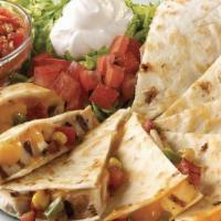 Chicken Quesadilla · Grilled chicken, monterey jack and cheddar cheeses, and corn salsa, all packed in a flour to...