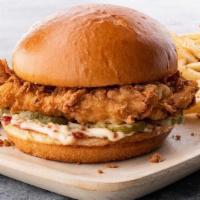 Chicken Fried Chicken Sandwich · Hand breaded, crispy golden fried chicken breast, with bacon-mayo and pickles on a toasted b...