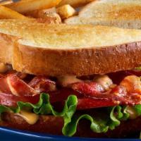 The Blt · Piled high with crispy strips of bacon, fresh lettuce, ripe tomatoes, and mayo on our homest...