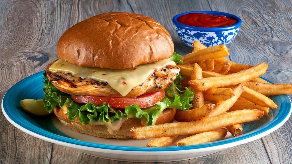 Grilled Chicken Sandwich · Juicy, seasoned grilled chicken breast topped with pepper jack cheese, fresh lettuce and tomato, and bacon-mayo on a toasted buttered bun