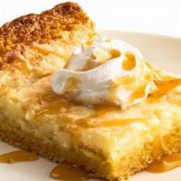 Mama'S Special Butter Cake · Buttery cake with a velvety cheesecake layer topped with whipped cream and caramel sauce.