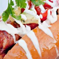 Mexican Hotdog · Comes with a large frank wrapped with bacon, ketchup, mayo, mustard, tomato and cebolla, wit...