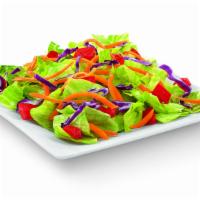 Side Salad · Fresh lettuce topped with diced tomatoes and shredded carrots and cabbage; available with yo...