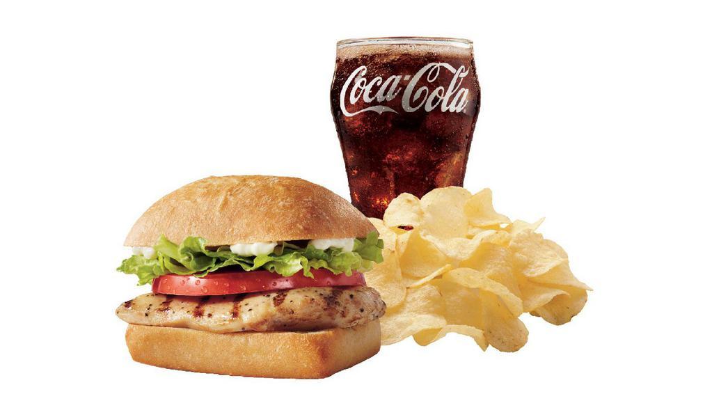 Grilled Chicken Sandwich Combo · Juicy all-white meat chicken breast topped with crisp lettuce, ripe tomatoes, and salad dressing on a toasted bun. Served with a regular side item and a medium drink.