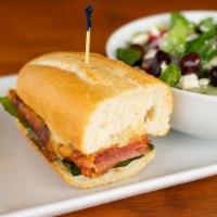 Italian Sub · Salami, Pepperoni, Ham, Lettuce, Red Onion, Tomato, and our Signature Cheese Blend drizzled ...